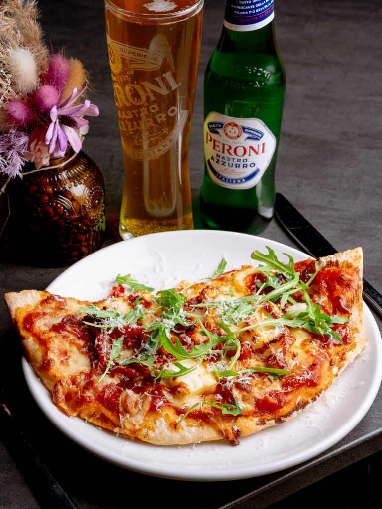 Spicy firecracker chicken pizza slice at Nesso Leeds Merrion Street