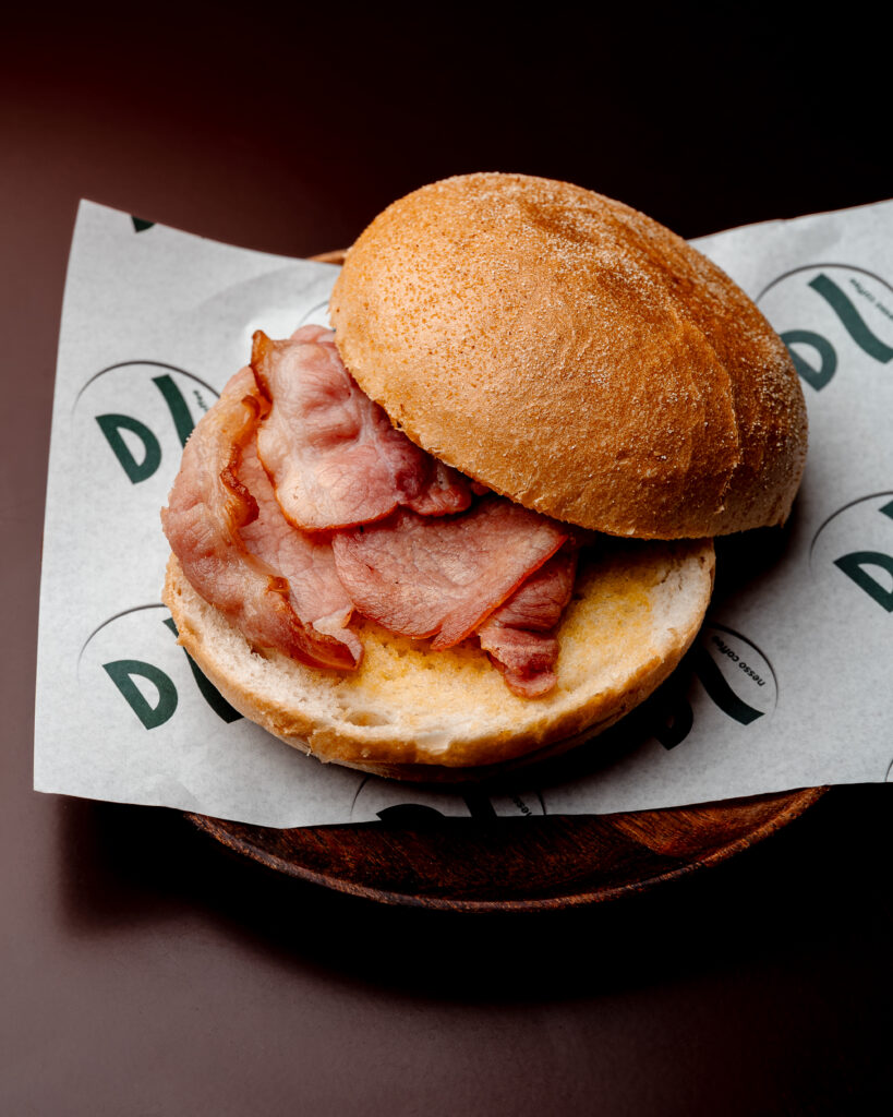 Bacon bap at Nesso Coffee Leeds with maple crispy cured bacon, ricotta cheese spread and brioche bap